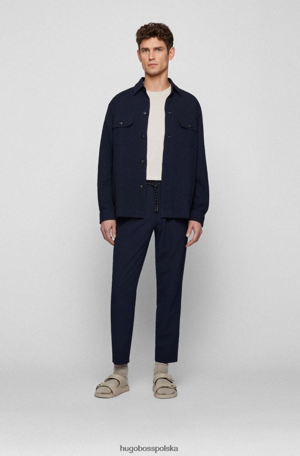 Hugo Boss Zwężane spodnie z efektownego, elastycznego ciemnoniebieskiego hugo typu seersucker ciemny niebieski R0X0H62858