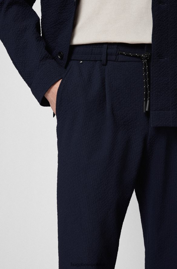 Hugo Boss Zwężane spodnie z efektownego, elastycznego ciemnoniebieskiego hugo typu seersucker ciemny niebieski R0X0H62858