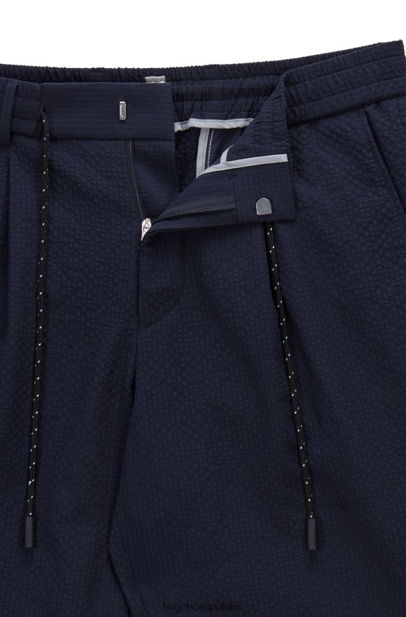 Hugo Boss Zwężane spodnie z efektownego, elastycznego ciemnoniebieskiego hugo typu seersucker ciemny niebieski R0X0H62858