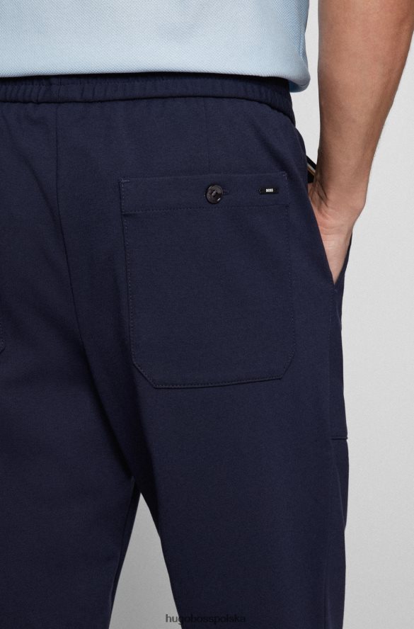 Hugo Boss Zwężane spodnie z elastycznego dżerseju w kolorze ciemnoniebieskim hugo ciemny niebieski R0X0H62074