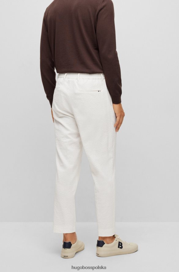 Hugo Boss Zwężane spodnie z elastycznej tkaniny typu Seersucker Hugo w kolorze białym biały R0X0H63326