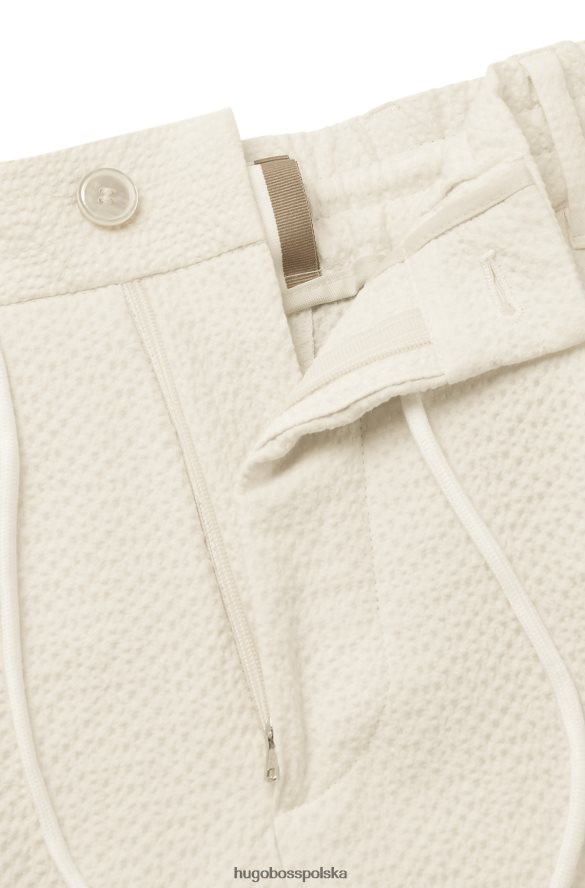 Hugo Boss Zwężane spodnie z elastycznej tkaniny typu Seersucker Hugo w kolorze białym biały R0X0H63326