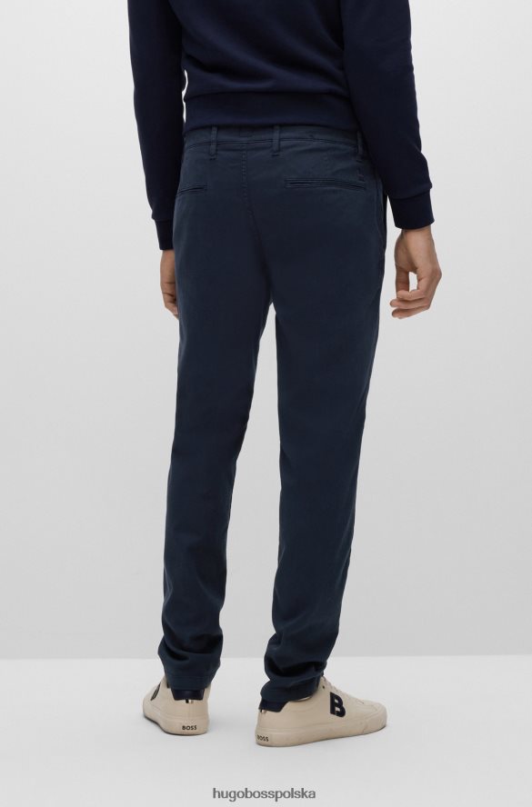 Hugo Boss Zwężane spodnie z mieszanki bawełny o strukturze plastra miodu hugo w kolorze ciemnoniebieskim ciemny niebieski R0X0H62305