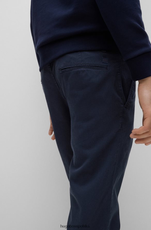 Hugo Boss Zwężane spodnie z mieszanki bawełny o strukturze plastra miodu hugo w kolorze ciemnoniebieskim ciemny niebieski R0X0H62305