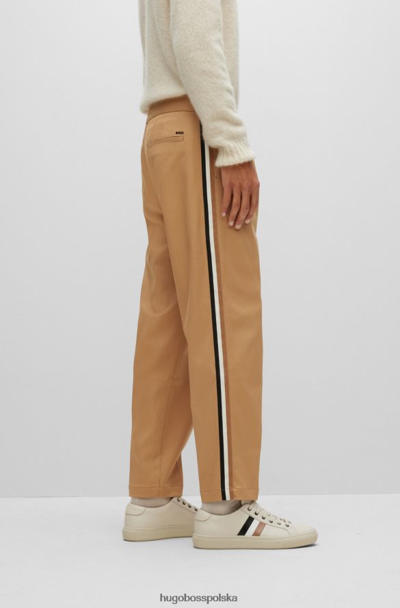 Hugo Boss Zwężane spodnie z włoskiej gabardyny z bocznymi paskami hugo w kolorze beżowym beżowy R0X0H64185