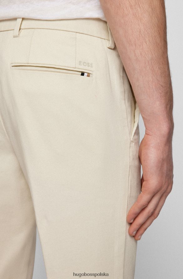 Hugo Boss białe chinosy Hugo o dopasowanym kroju ze strukturalnej elastycznej bawełny biały R0X0H62947