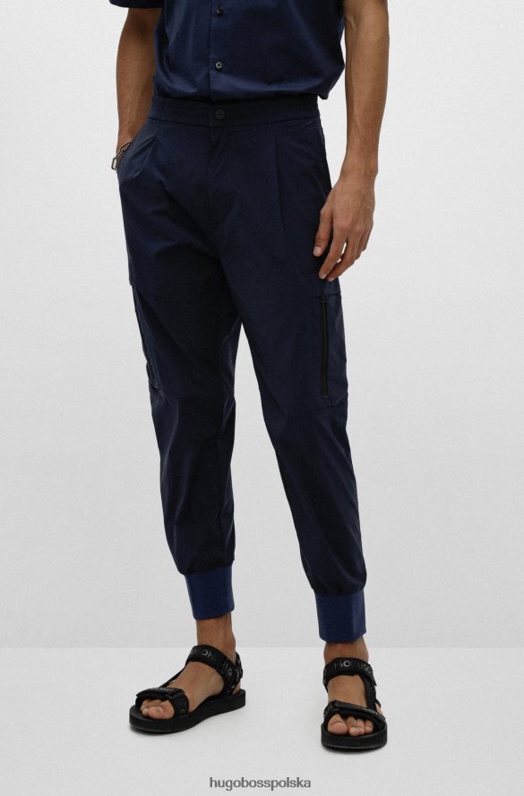 Hugo Boss ciemnoniebieskie spodnie slim-fit z mankietami i czerwoną metką z logo hugo ciemny niebieski R0X0H64302