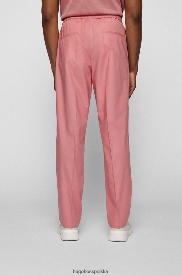 Hugo Boss jasnoróżowe, długie, luźne spodnie Hugo z elastycznej bawełny jasnoróżowy R0X0H64437