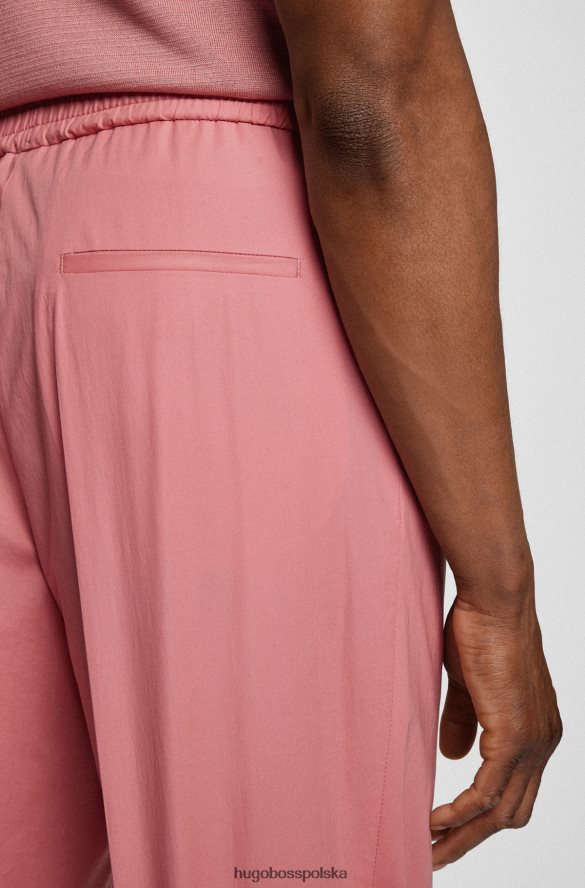 Hugo Boss jasnoróżowe, długie, luźne spodnie Hugo z elastycznej bawełny jasnoróżowy R0X0H64437