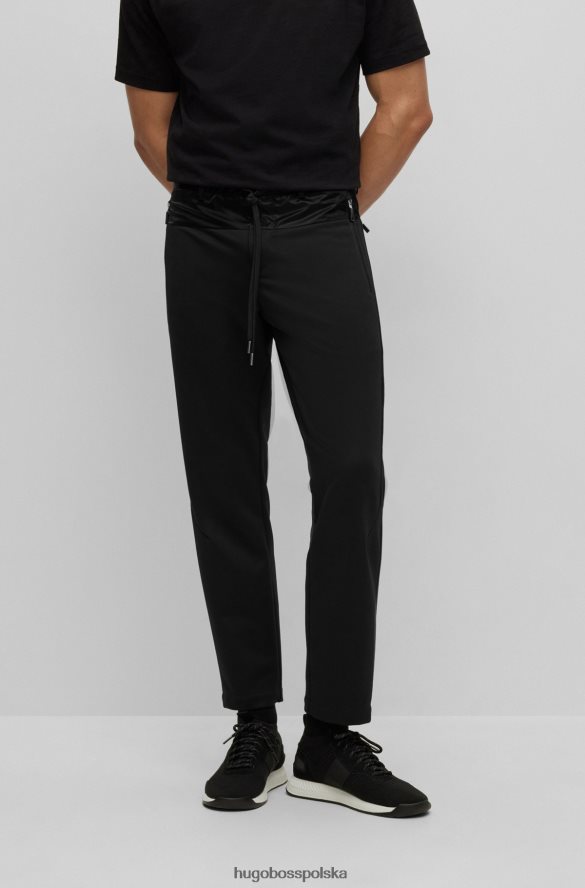 Hugo Boss x ajbxng Wąskie spodnie z regularnym stanem i wspólnym brandingiem czarny R0X0H62728
