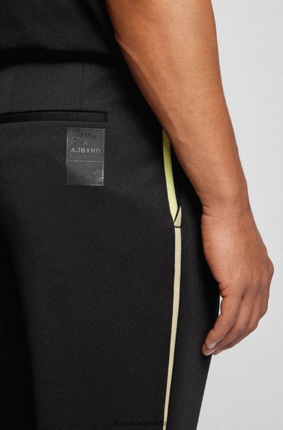 Hugo Boss x ajbxng Zwężane spodnie z bi-stretchowego dżerseju czarny R0X0H64007